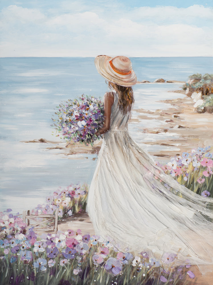 Frau am Strand mit weißem Kleid